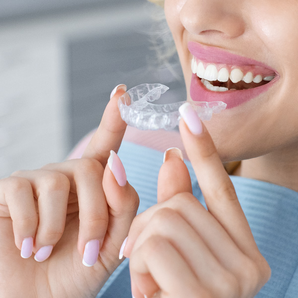 Girl wearing teeth aligners